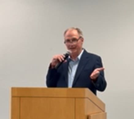 Tim Hughes at the podium during the Clearwater solar celebration